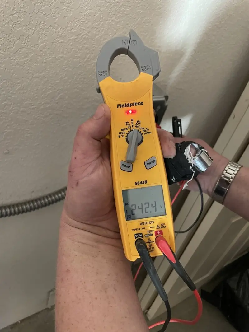 Voltage testing with clamp meter during Whole House Surge Protector in Hudson